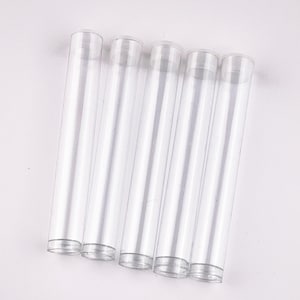 May include: Five clear, cylindrical plastic tubes arranged vertically side by side. Each tube features a smooth, transparent body with a slightly thicker rim at the top and a flat base at the bottom, designed for storage or display purposes.