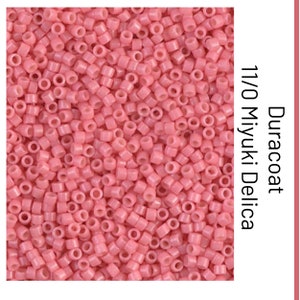 May include: A close-up image of a pile of small, pink, round beads. The beads are 11/0 size and are made by Miyuki. The beads are labeled "Duracoat".