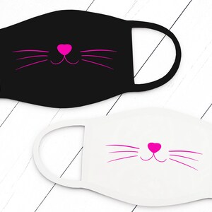 May include: Two cloth face masks with a pink cat face design. One mask is black and the other is white.