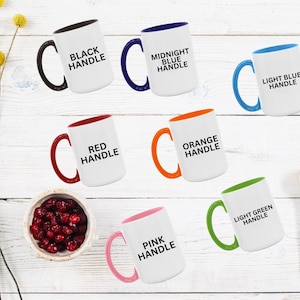 May include: A white ceramic mug with a black handle and the text "But First, Coffee" in a handwritten style. The mug is on a white surface. The mug is 4 inches tall.