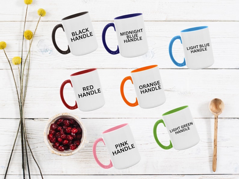 May include: A white ceramic mug with a black handle and the text "But First, Coffee" in a handwritten style. The mug is on a white surface. The mug is 4 inches tall.