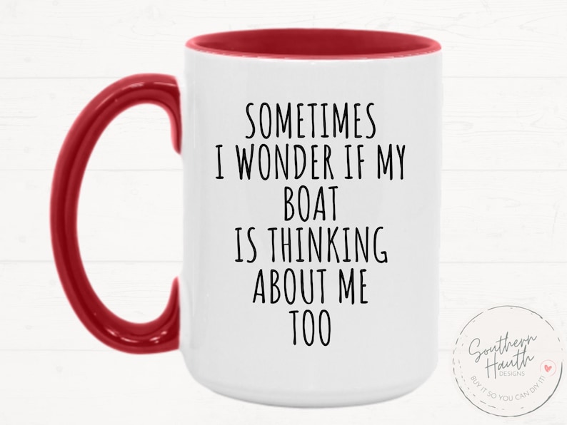 May include: White ceramic mug with a red handle and interior. The mug features the text "SOMETIMES I WONDER IF MY BOAT IS THINKING ABOUT ME TOO" in black. A small circular logo is visible on the right side.
