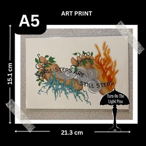 May include: An art print with a white background featuring a hand-drawn illustration of two hands with flames and water. The text "Small steps are still steps" is written in a stylized font. The text "Turn on the light pins" is written in a smaller font below the illustration.
