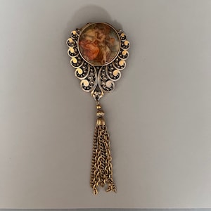 Vintage Victorian Locket Brooch. Has an Elegant Image, Tassel, and Design. A Special Photo Completes this Piece. A Nice Gift.