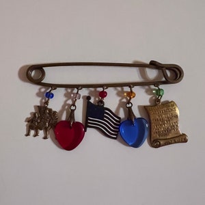 Vintage Charm Patriotic Brooch/Pin. Has Beautiful Charms. A Perfect Addition to Your Fourth of July.