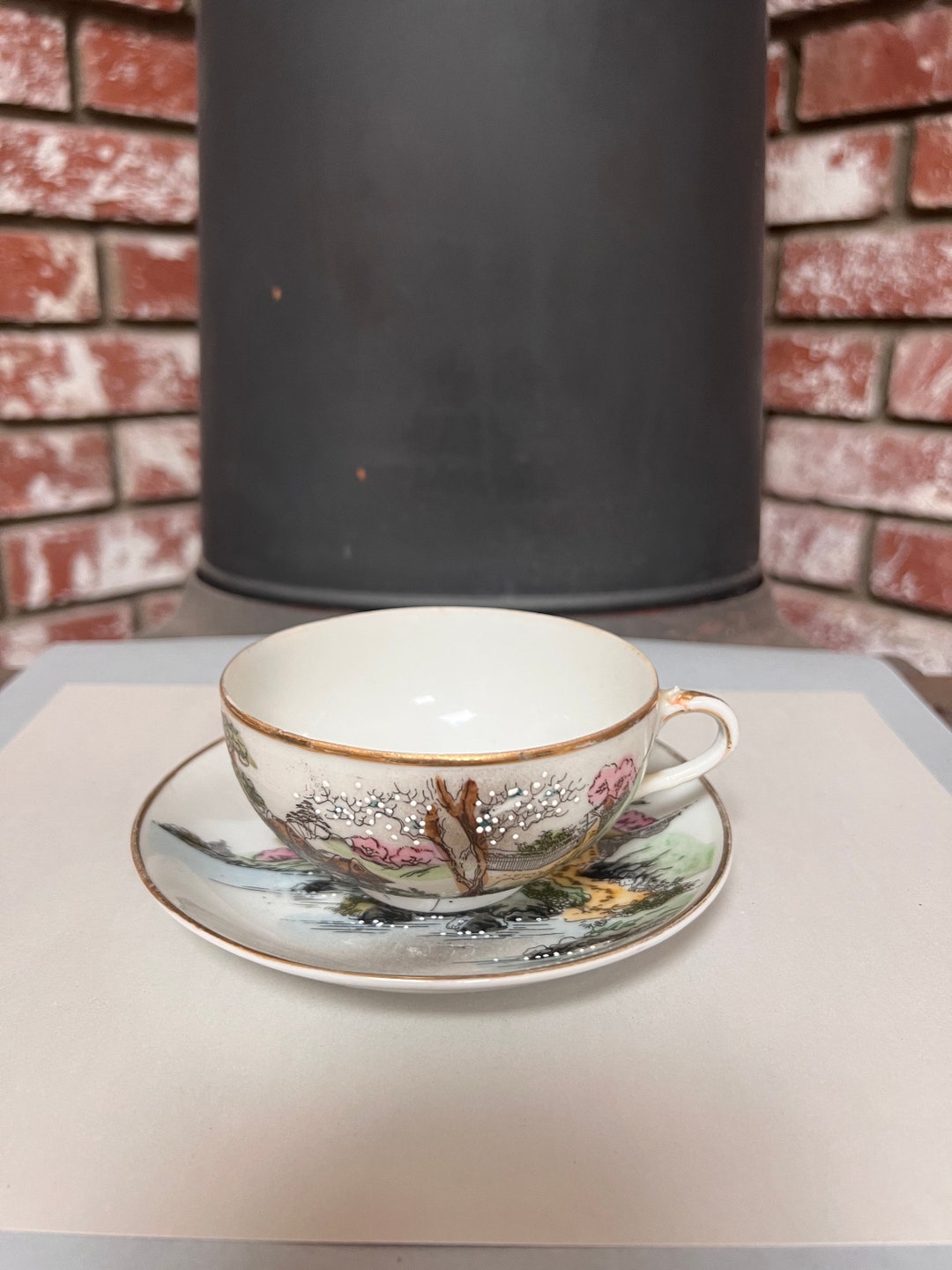 Vintage Asian Tea Cup and Saucer. Has Beautiful Designs With Gold Trim