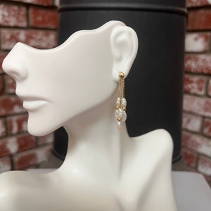 14K Solid Gold Dangling Earrings With Beautiful Fresh Water Pearls.