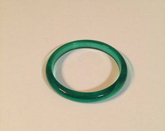 Vintage Plastic Bangle. Has a Beautiful Lucite Like Green Color. A Nice Addition to Your Fun Day. Favorite this item receive 20% off.