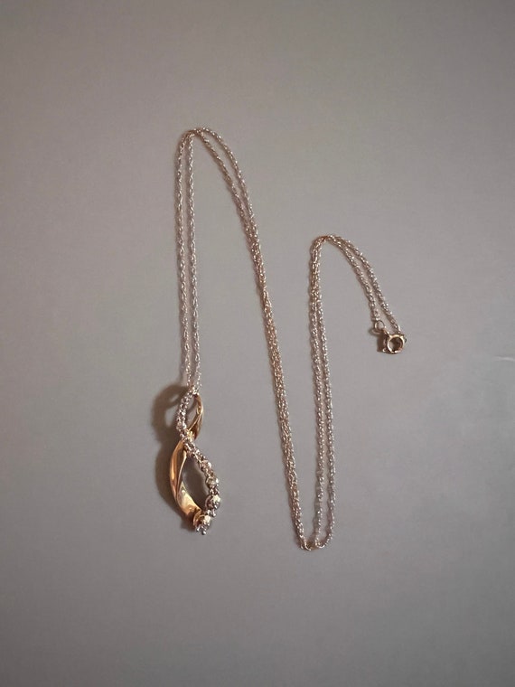 10K Solid Gold Necklace with Diamonds. Has Beautiful Designs.