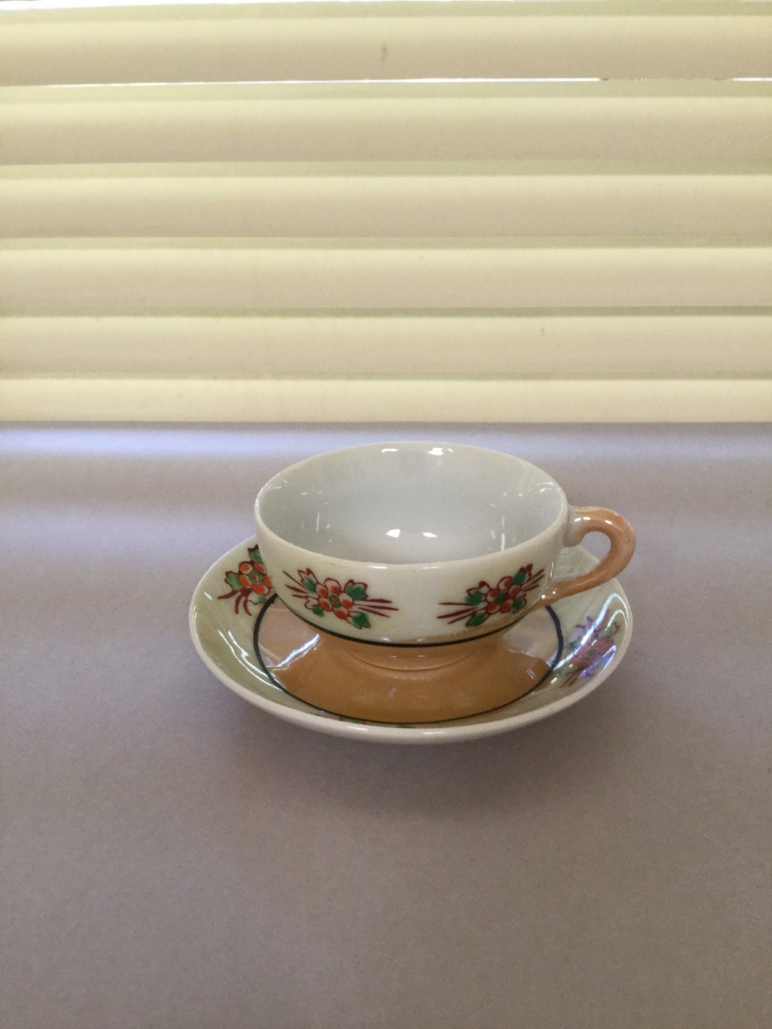 Vintage Small Tea Cup and Saucer. Has Beautiful Iridescent Colors and