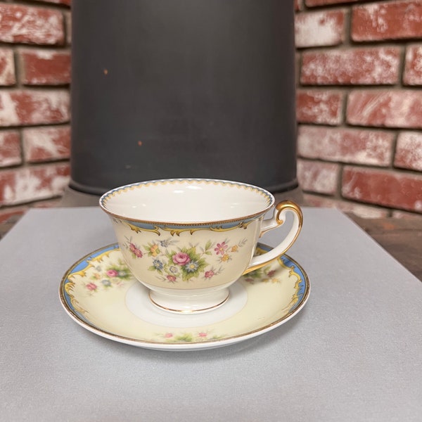 Vintage Meito China Tea Cup and Saucer. Made in Japan. Has Beautiful Flowers with Blue and Gold Trim. A Nice Gift.