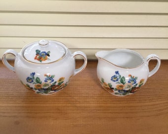 Vintage Victoria Sugar and Creamer. Made in Czechoslovakia. Has Beautiful Flower Designs and Gold Trim.