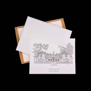 May include: A set of stationery featuring a detailed black and white illustration of a building with trees. The set includes a card, envelope, and a gold-trimmed box. The card has the text "Add Custom Text or Personalization".