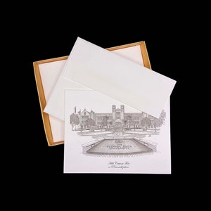 May include: A black and white illustration of the Florida State University campus, featuring the Old Capitol building. The illustration is printed on a white card with a gold border. The card is in a white envelope with a gold border.