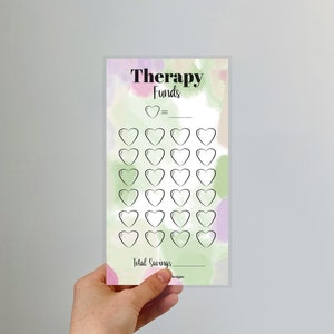 May include: A printable therapy funds tracker with a watercolour background. The tracker has 30 hearts to colour in as you save money for therapy sessions. The text reads "Therapy Funds" and "Total Savings".
