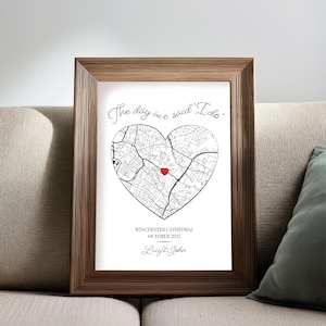 May include: A framed print with a heart-shaped map, a red heart marking a location, and the text "The day we said 'I do'". Below the map are the words "Winchester Cathedral, October 2025" and names.