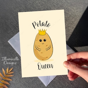 May include: A greeting card with a cartoon potato wearing a gold crown. The text on the card reads "Potato Queen".