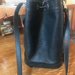 Vintage Longchamp drawstring leather purse, made in France...