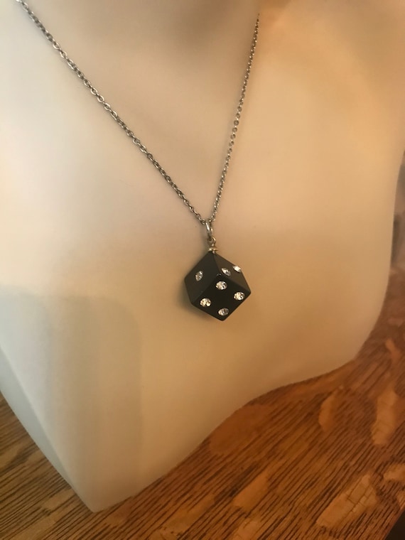 Black Bakelite/lucite dice with clear rhinestones from an estate sale.