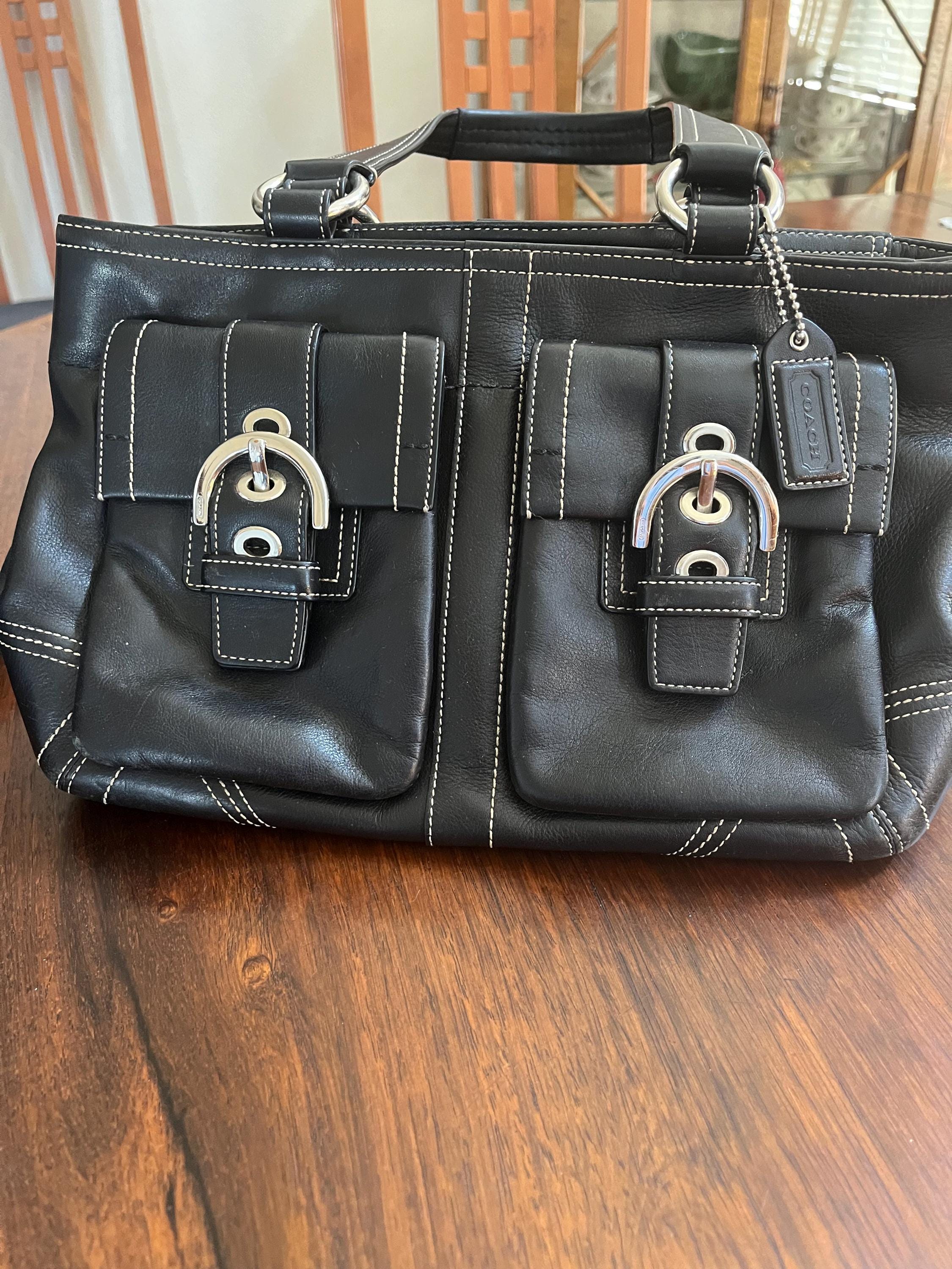 Vintage Coach black leather purse from the 1990's in very good condition.