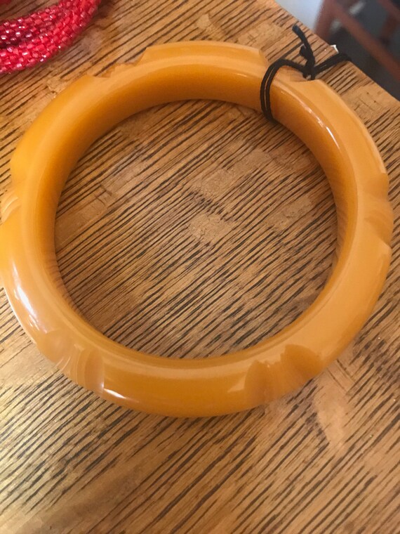 Beautifully carved, vintage butterscotch Bakelite 