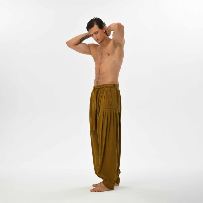 Comfy brown harem trousers for men, featuring a relaxed fit and breathable cotton fabric, ideal for lounging or yoga sessions.