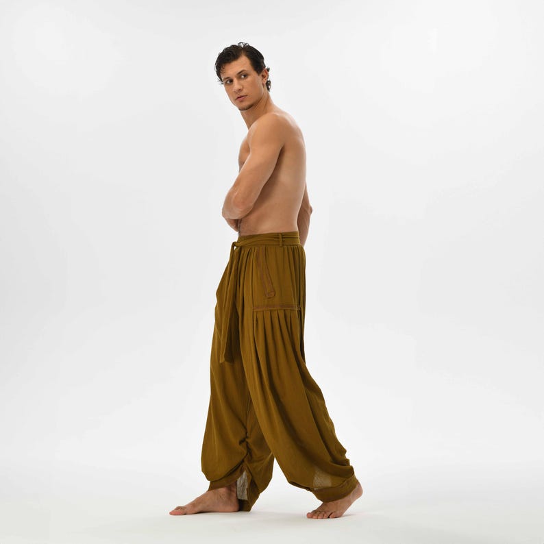 Boho chic brown pants for men, featuring a loose harem fit and breathable cotton, perfect for yoga or bohemian-inspired fashion.