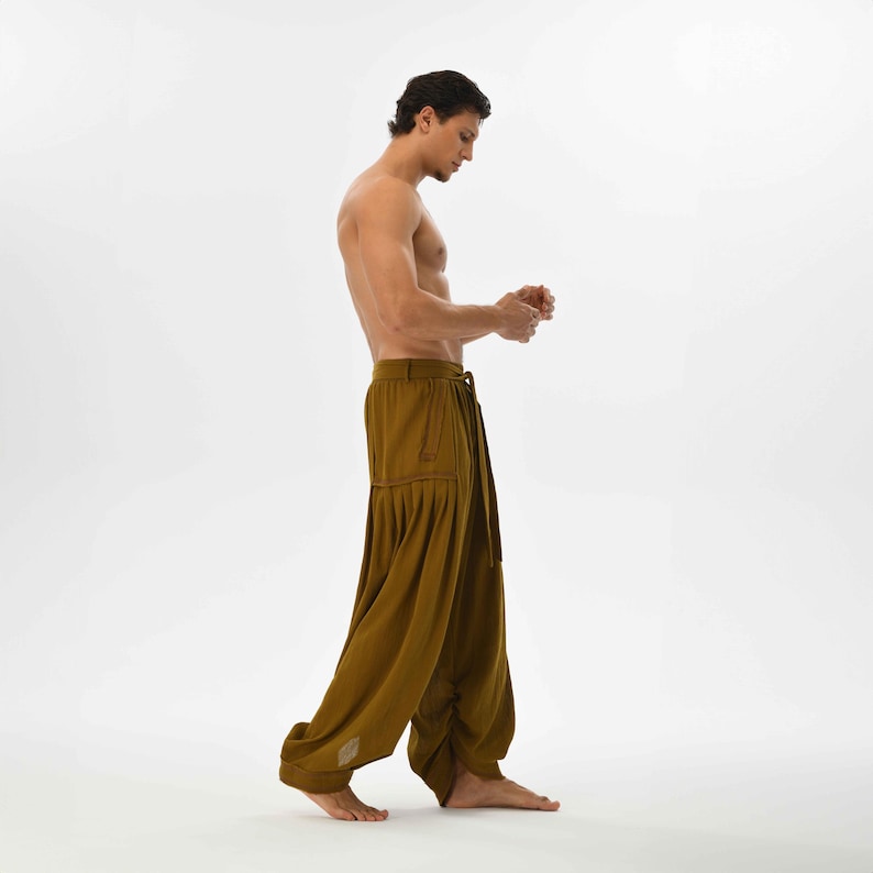 Earthy brown boho pants for men, designed with a harem cut and comfy cotton fabric, perfect for festivals and casual wear.