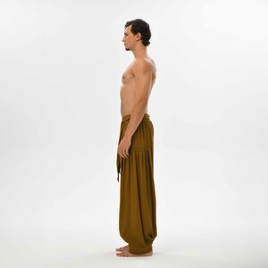 Comfy brown yoga pants for men, crafted from soft cotton with a loose fit, ideal for casual wear, lounging, or festivals.