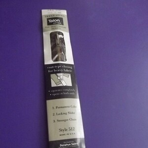 May include: A package of Talon separating zipper for heavy fabric. The package is white and black with the Talon logo and product information. The zipper is Style 512 and is made in the USA.