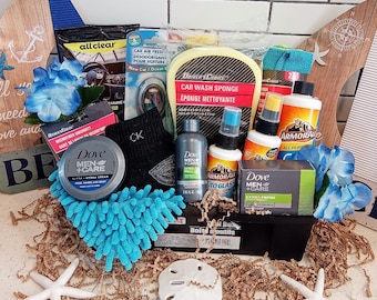 May include: A gift basket filled with car care products, including a sponge, microfiber cloths, car wash soap, and a bottle of glass cleaner. The basket is decorated with blue and white nautical themed items, including a starfish and a seashell.