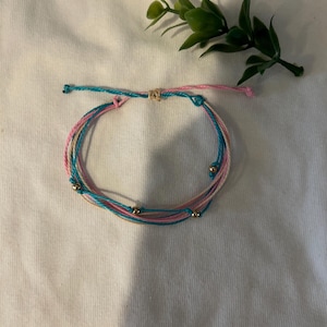 Gold bliss wax string bracelet