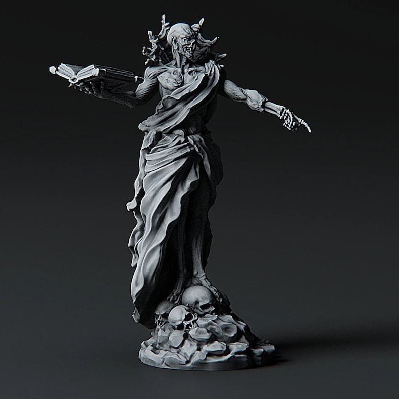 May include: A skeletal figure with a book in one hand and a raised finger in the other, standing on a base with skulls. The figure is wearing a flowing robe and has a skull-like face.