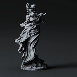 May include: A gray, sculpted figure of a person wearing a flowing robe. The figure is holding a staff in one hand and a book in the other. The figure is standing on a base.