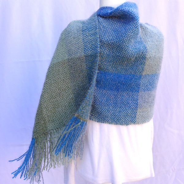 Handwoven heaven: a shawl of cloud-soft blues & greens! Use as scarf, wrap, shawl. Beautiful yarn with a bit of fuzziness to cuddle.