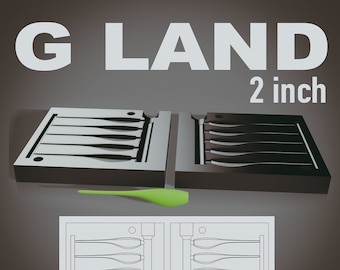 May include: A black mold with the text "G LAND" and "2 inch" in white. The mold is open, revealing the shape of a fishing lure. A green fishing lure is next to the mold. A diagram of the mold is below.