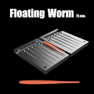 Puede incluir: Un señuelo de gusano flotante naranja de 75 mm se muestra sobre un fondo negro. El señuelo se muestra en un molde, con el texto "Floating Worm" arriba. La imagen también muestra un solo gusano.