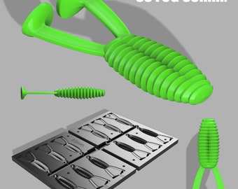 May include: A green plastic fishing lure with a ribbed body and two legs. The lure is 83 mm long and is shown next to a mold for making the lure.