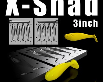May include: Image features a black background with the text "X-Shad" and "3inch" in white. It showcases a fishing lure mold and several yellow, 3-inch (7.6 cm) shad-shaped lures. The mold is gray and contains multiple fish-shaped cavities.