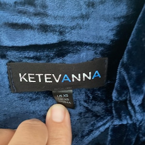 May include: A navy blue velvet top with a black label that reads "KetevAnna" and a size tag that says "US XS, UK XS".