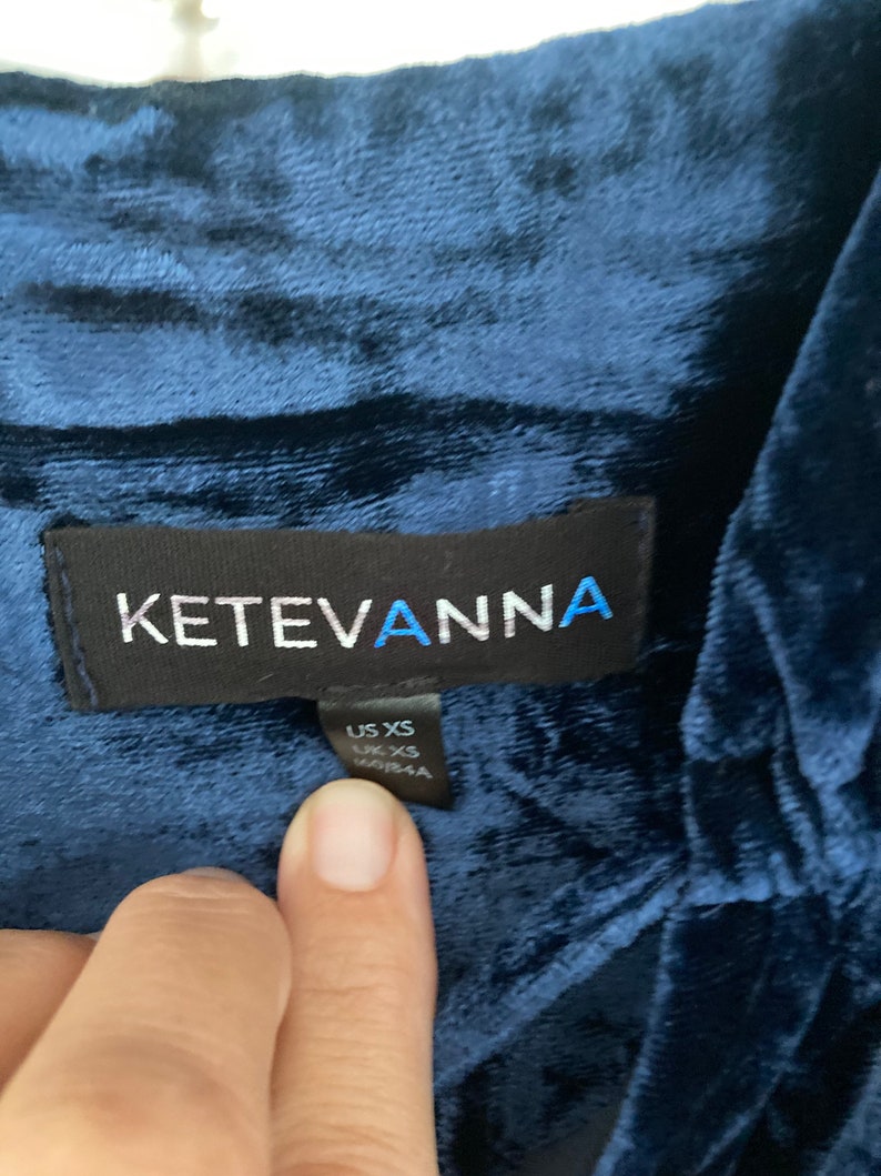 May include: A navy blue velvet top with a black label that reads "KetevAnna" and a size tag that says "US XS, UK XS".