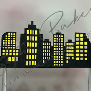 Skyscraper background cake topper