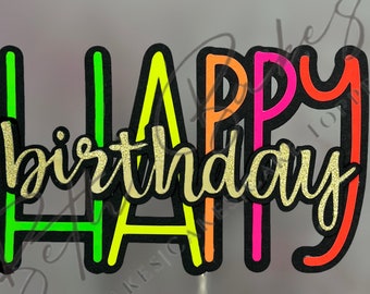 May include: Happy birthday cake topper with neon green, yellow, pink, and red letters with black outlines. The word "birthday" is in gold glitter.