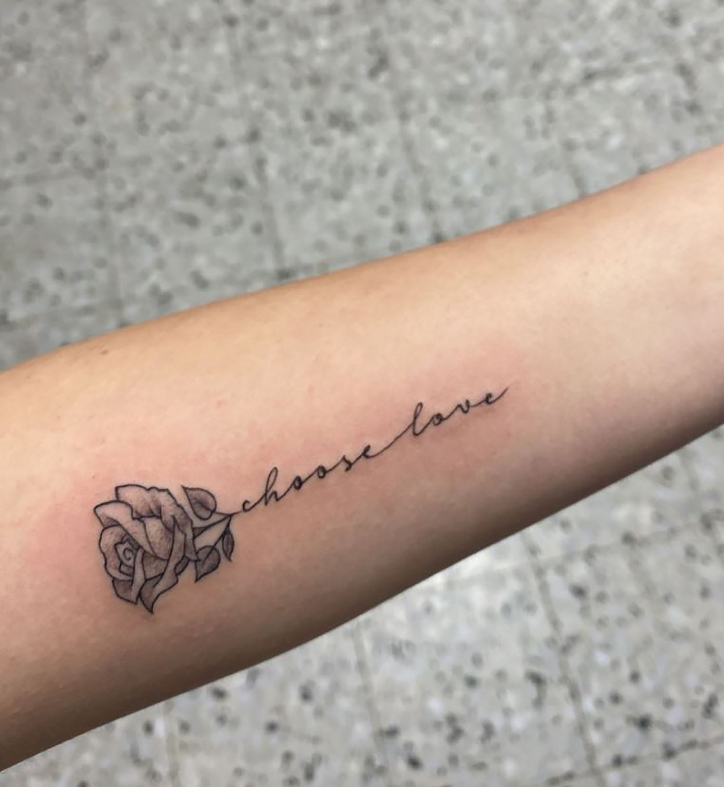 Would something like this hand holding rose tattoo look good next to the  girl thats already on my arm It would be in black and gray   rTattooDesigns