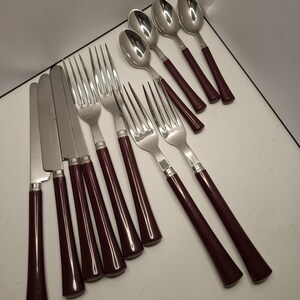 Chabanne France vintage bestickset med bakelithandtag 16 delar 4 gafflar 4 skedar 4 knivar