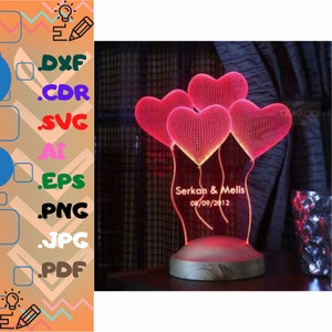 May include: A decorative LED lamp in the shape of hearts, with a wooden base. The lamp has five red heart shapes, with the names "Serkan & Melis" and the date "08/09/2012" engraved on the front. Ideal for home decoration.