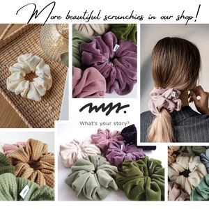 May include: A selection of scrunchies in shades of cream, pink, purple, and green, made from diverse fabrics. The image includes the text "More beautiful scrunchies in our shop!" and "What's your story?"