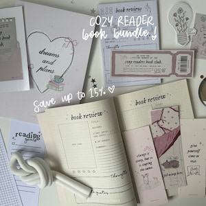 May include: A collection of printable planner pages and bookmarks with a pink and white color scheme. The pages include a book review template, a daily reading log, and a reading goals tracker. The bookmarks feature inspirational quotes about reading and change. The text "Cozy Reader Book Bundle!" is written in pink on a white background.