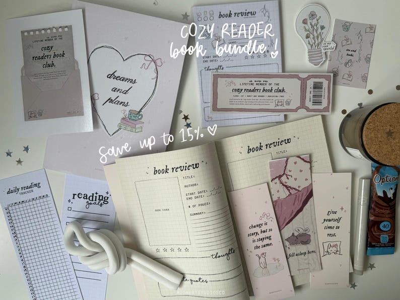 May include: A collection of printable planner pages and bookmarks with a pink and white color scheme. The pages include a book review template, a daily reading log, and a reading goals tracker. The bookmarks feature inspirational quotes about reading and change. The text "Cozy Reader Book Bundle!" is written in pink on a white background.