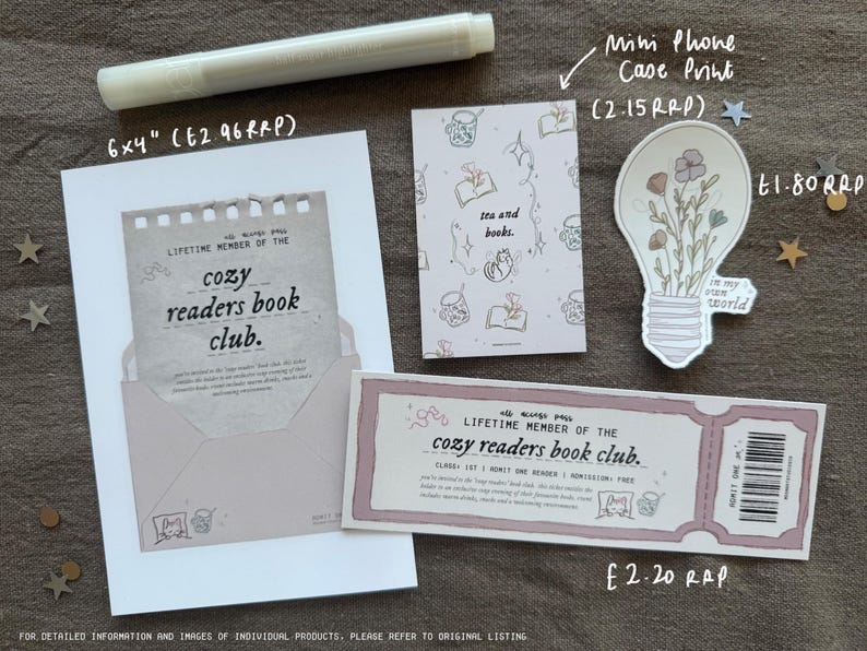 May include: A pink and white printable card with the text "Lifetime Member of the Cozy Readers Book Club." The card is 6 inches by 4 inches and costs $2.96. There is also a light bulb illustration with flowers and the text "In my own world." The light bulb is 1.80 inches in diameter.
